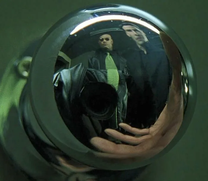 The Director Of Photography ( On The Matrix) Hid Him Self Using A Coat With A Tie Matching The One Morpheus Was Wearing, Trying To Blend In As Much As Possible